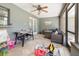 An enclosed sunroom featuring comfortable seating, tile floors and plentiful light at 1100 Anne Elisa Cir, St Cloud, FL 34772