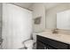 Clean bathroom featuring a shower with decorative curtain, toilet, and modern vanity at 11120 Whistling Pine Way, Orlando, FL 32832