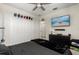 Bedroom with TV and large closet with a black blanket on the foot of the bed at 11120 Whistling Pine Way, Orlando, FL 32832