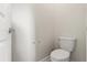 Clean, minimalist toilet space showcasing a standard toilet at 11120 Whistling Pine Way, Orlando, FL 32832