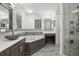 Bright bathroom features a soaking tub, updated vanity, sleek fixtures and a glass shower showcasing a clean aesthetic at 1116 Oak Pond Dr, Celebration, FL 34747