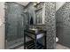 Stylish bathroom featuring mosaic tile, modern vanity, and glass-enclosed shower at 1116 Oak Pond Dr, Celebration, FL 34747