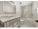 Bright, renovated bathroom with a marble countertop, shower, and modern tiles offering a relaxing and stylish space at 1116 Oak Pond Dr, Celebration, FL 34747