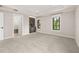 Spacious bedroom with plush carpeting, tray ceilings, natural light, and a built-in bar, perfect for relaxing and entertaining at 1116 Oak Pond Dr, Celebration, FL 34747