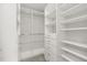Organized walk-in closet featuring ample shelving, drawers, and hanging rods providing a functional storage system at 1116 Oak Pond Dr, Celebration, FL 34747