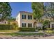 Charming two-story home featuring a tile roof, green shutters, and landscaped front yard at 1116 Oak Pond Dr, Celebration, FL 34747