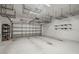 Spacious garage with installed overhead storage racks provides plenty of space and organization at 1116 Oak Pond Dr, Celebration, FL 34747