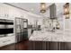 Modern kitchen featuring a spacious island, stainless steel appliances, and ample cabinetry at 1116 Oak Pond Dr, Celebration, FL 34747