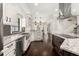 This spacious kitchen features granite countertops, stainless appliances, dark wood floors and lots of cabinet space at 1116 Oak Pond Dr, Celebration, FL 34747