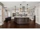 Spacious kitchen featuring a large island, custom cabinetry, and modern stainless steel appliances at 1116 Oak Pond Dr, Celebration, FL 34747