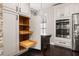 Gourmet kitchen featuring stainless appliances, a built-in microwave and oven, and custom cabinets with pull out shelves at 1116 Oak Pond Dr, Celebration, FL 34747