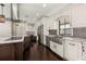Modern kitchen with white cabinets, stainless steel appliances, and a large center island at 1116 Oak Pond Dr, Celebration, FL 34747