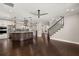 Open concept kitchen with a large island, modern appliances, and staircase access at 1116 Oak Pond Dr, Celebration, FL 34747