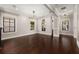 Bright living room features gleaming hardwood floors, classic millwork, and elegant lighting fixtures at 1116 Oak Pond Dr, Celebration, FL 34747