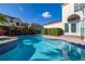 Backyard pool with a view of the home, privacy landscaping and lush tropical foliage at 1116 Oak Pond Dr, Celebration, FL 34747