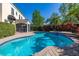 Relaxing backyard pool with a brick patio, tropical landscaping, a privacy fence, and a covered patio at 1116 Oak Pond Dr, Celebration, FL 34747