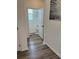 Hallway view into a well-lit half bathroom with modern fixtures at 11688 Founders St, Orlando, FL 32832