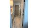 Bathroom displays a vanity with sink, elegant tile flooring, and glass-enclosed shower, blending style and practicality at 11688 Founders St, Orlando, FL 32832