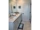 Bathroom displays a vanity with double sinks, bright lighting, and elegant tile, offering a comfortable and functional space at 11688 Founders St, Orlando, FL 32832
