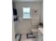 Cozy bathroom featuring a shower, toilet, and window with natural light at 11688 Founders St, Orlando, FL 32832