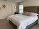 Comfortable bedroom features a large bed, and window, creating a relaxing retreat at 11688 Founders St, Orlando, FL 32832