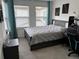 Bedroom showcases a stylish bed, workstation, and neutral decor, creating a serene and conducive atmosphere at 11688 Founders St, Orlando, FL 32832