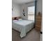 Cozy bedroom with a window and light blue bedding at 11688 Founders St, Orlando, FL 32832