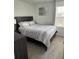 Bedroom featuring a comfortable bed, neutral tones, and soft lighting, designed to promote a tranquil night's sleep at 11688 Founders St, Orlando, FL 32832