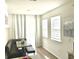 Bright breakfast nook features a built-in bench, modern table, light-filled windows, and sliding glass door at 11688 Founders St, Orlando, FL 32832