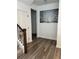 Inviting entryway with hardwood floors and decorative staircase at 11688 Founders St, Orlando, FL 32832