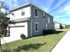 Two-story home with a well-maintained lawn, siding, and shutters at 11688 Founders St, Orlando, FL 32832