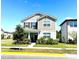 Charming two-story home with well-manicured lawn and lush landscaping at 11688 Founders St, Orlando, FL 32832