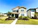 Charming two-story home with well-manicured lawn and lush landscaping at 11688 Founders St, Orlando, FL 32832