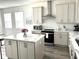Bright kitchen with a large island, stainless steel appliances, and plenty of cabinet space at 11688 Founders St, Orlando, FL 32832