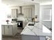 Spacious kitchen with a large island and white countertops and stainless steel appliances at 11688 Founders St, Orlando, FL 32832