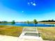 Enjoy a picturesque view of the lake from the comfort of a bench in this stunning community at 11688 Founders St, Orlando, FL 32832