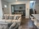 Comfortable living room and dining room featuring a cozy sofa and bar seating at 11688 Founders St, Orlando, FL 32832