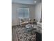 Comfortable living room with an area rug and stylish decor at 11688 Founders St, Orlando, FL 32832