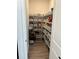 Well-organized walk-in pantry with shelving and storage baskets at 11688 Founders St, Orlando, FL 32832