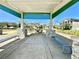 A shady pavilion with stone columns provides a gathering space to relax in the community at 11688 Founders St, Orlando, FL 32832