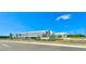 Innovation High School exterior view with manicured landscaping on a bright, sunny day at 11688 Founders St, Orlando, FL 32832