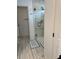 Bright bathroom features a modern shower with seamless glass enclosure, sleek fixtures and easy accessibility at 11688 Founders St, Orlando, FL 32832