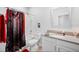 Well-lit bathroom with a shower-tub combo, a framed mirror, and a single sink vanity at 1231 Sandwedge St, Davenport, FL 33896