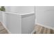 Hallway with hardwood flooring and white walls at 1231 Sandwedge St, Davenport, FL 33896