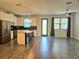 Open-concept kitchen and living room with modern finishes at 1231 Sandwedge St, Davenport, FL 33896
