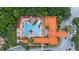 Overhead view of community showcasing pool, clubhouse, lush landscaping, and well-maintained grounds at 1375 Tuscana Ln # 1207, Davenport, FL 33896