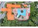 Aerial view of community pool area, showcasing resort-style amenities and lush landscaping at 1375 Tuscana Ln # 1207, Davenport, FL 33896
