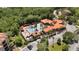 Aerial view of community featuring resort-style pool, lush landscaping, and luxurious amenities at 1375 Tuscana Ln # 1207, Davenport, FL 33896