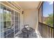 Comfortable screened balcony with seating area offering tranquil outdoor space at 1375 Tuscana Ln # 1207, Davenport, FL 33896