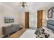 Relaxing bedroom features a plush bed, modern dresser, and a flat-screen TV at 1375 Tuscana Ln # 1207, Davenport, FL 33896